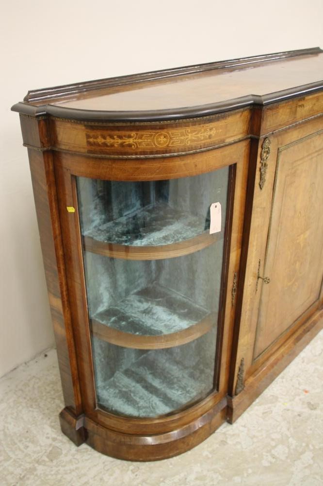 A VICTORIAN WALNUT AND EBONISED CREDENZA of breakfront D form with stringing and gilt metal mounts Image