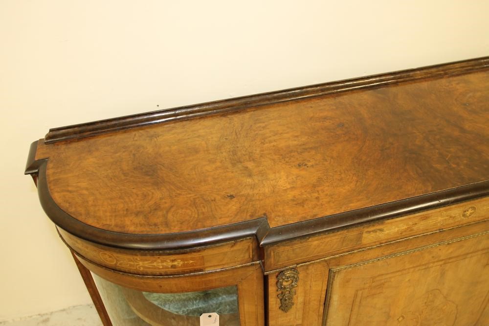 A VICTORIAN WALNUT AND EBONISED CREDENZA of breakfront D form with stringing and gilt metal mounts Image