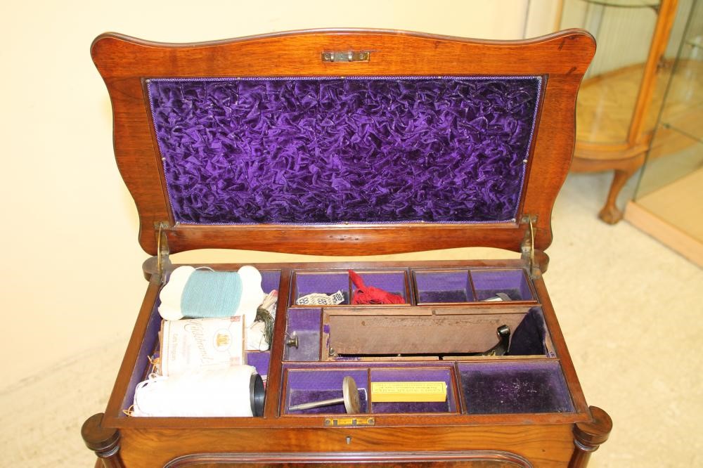 A VICTORIAN SEWING MACHINE by Willcox & Gibbs Image