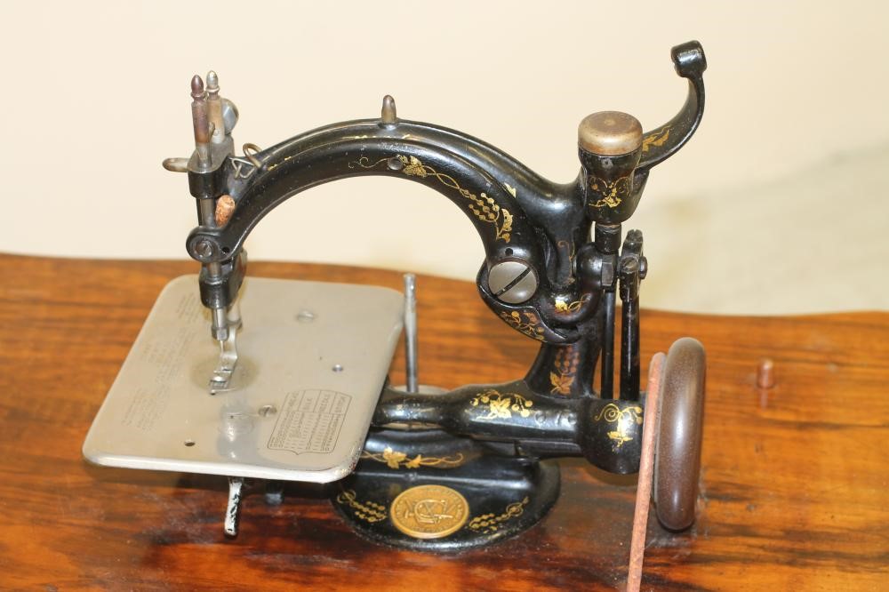 A VICTORIAN SEWING MACHINE by Willcox & Gibbs Image