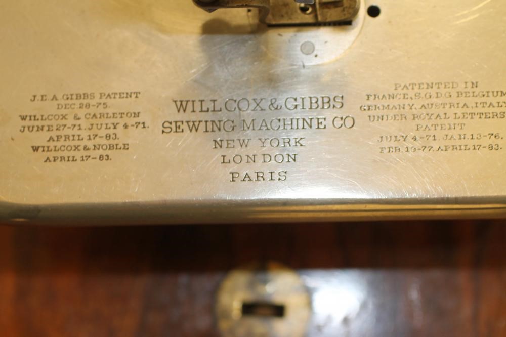 A VICTORIAN SEWING MACHINE by Willcox & Gibbs Image