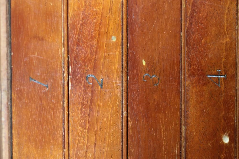 AN EDWARDIAN MAHOGANY SPECIMEN CABINET of oblong form with stringing Image