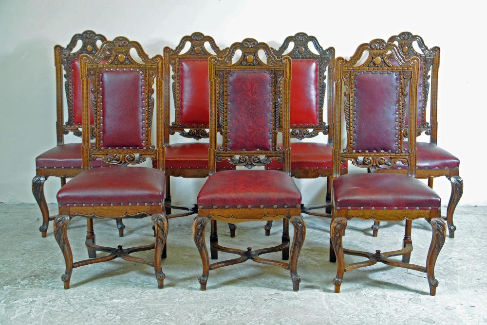 A SET OF SEVEN OAK VICTORIAN SINGLE CHAIRS upholstered in red leather Image