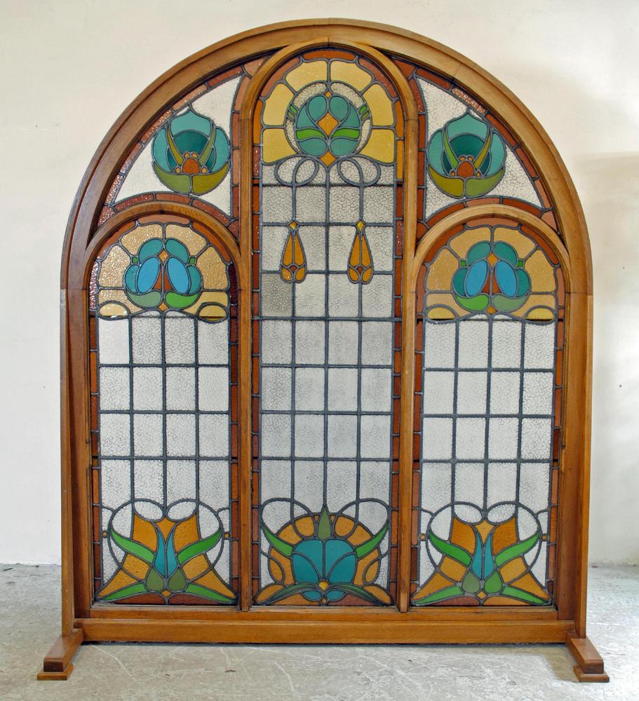 AN OAK FRAMED STAINED AND CRIZZLED LEADED GLASS PANEL Image