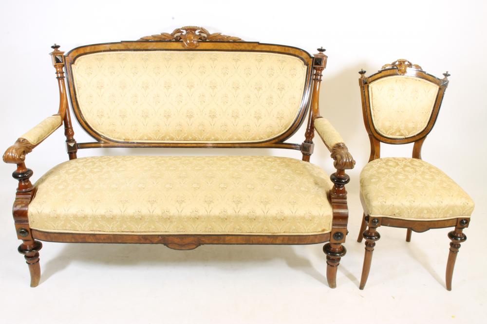 A VICTORIAN WALNUT AND EBONISED PART SALON SUITE upholstered in cream floral silk weave Image