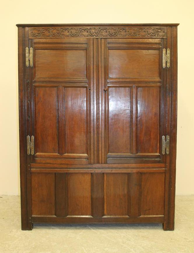 AN OAK LIVERY CUPBOARD Image