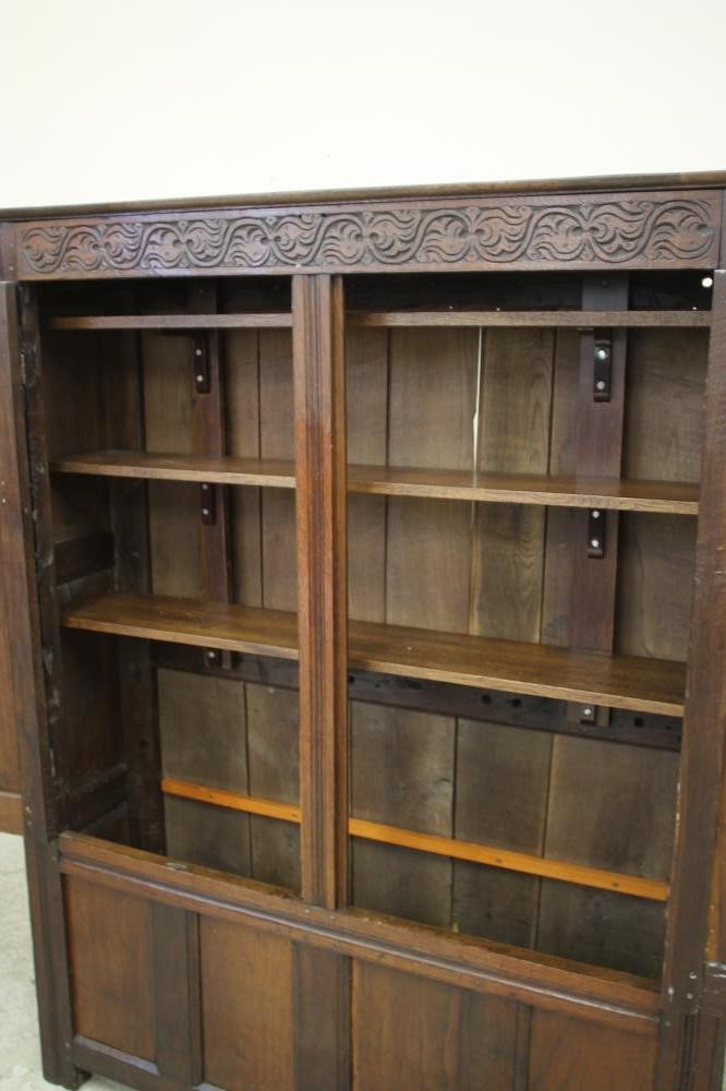 AN OAK LIVERY CUPBOARD Image