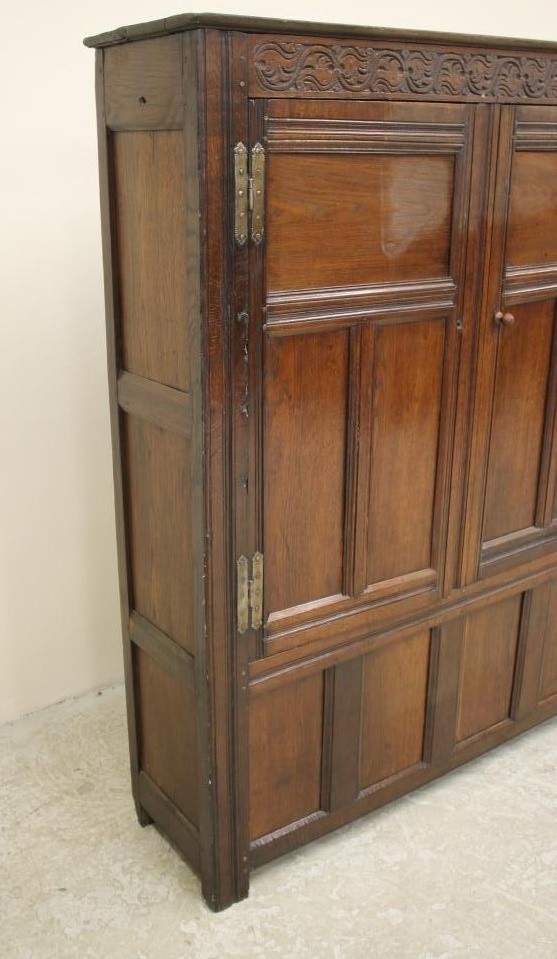 AN OAK LIVERY CUPBOARD Image