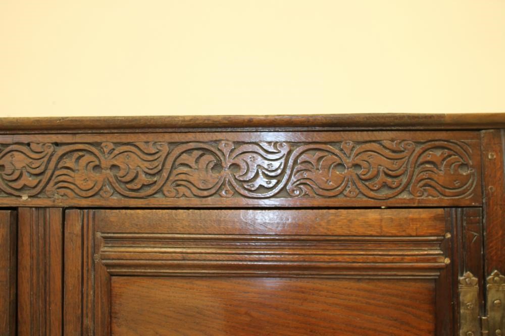 AN OAK LIVERY CUPBOARD Image