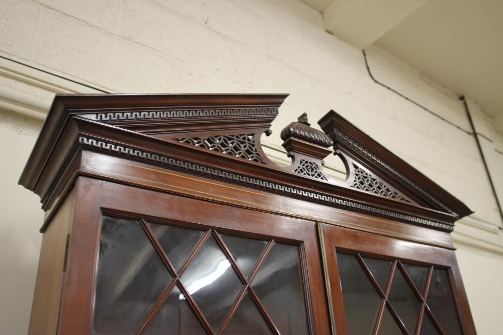 A GEORGIAN STYLE MAHOGANY AND STRING INLAID BUREAU BOOKCASE Image