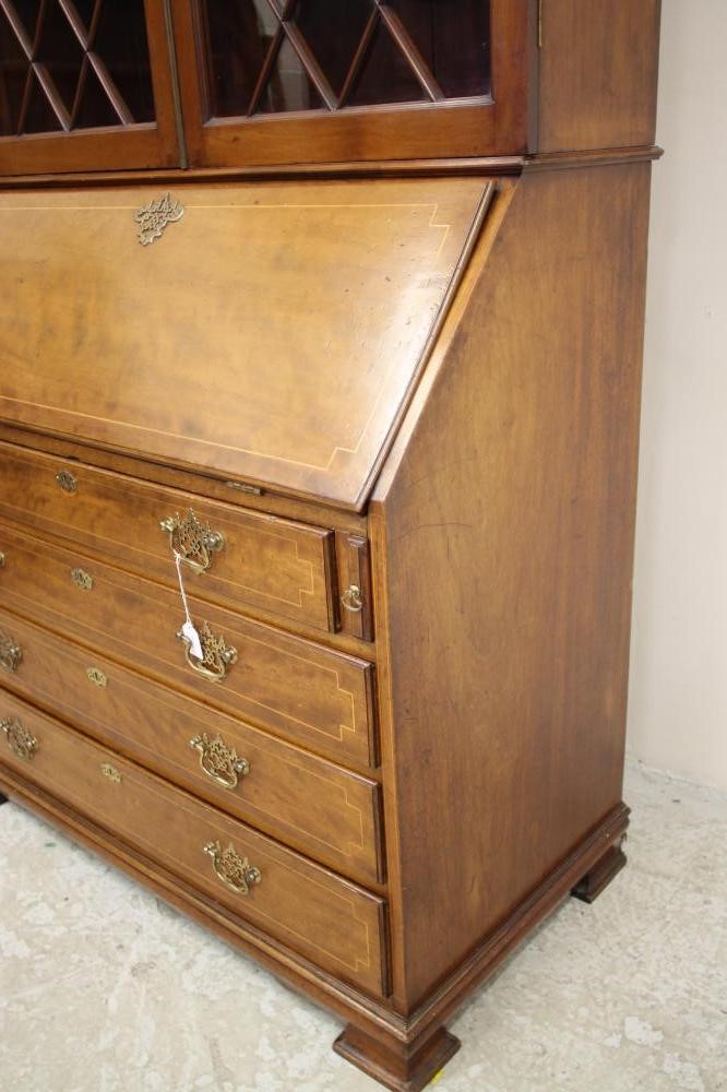 A GEORGIAN STYLE MAHOGANY AND STRING INLAID BUREAU BOOKCASE Image