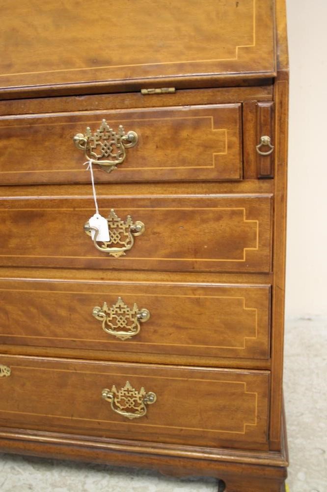A GEORGIAN STYLE MAHOGANY AND STRING INLAID BUREAU BOOKCASE Image
