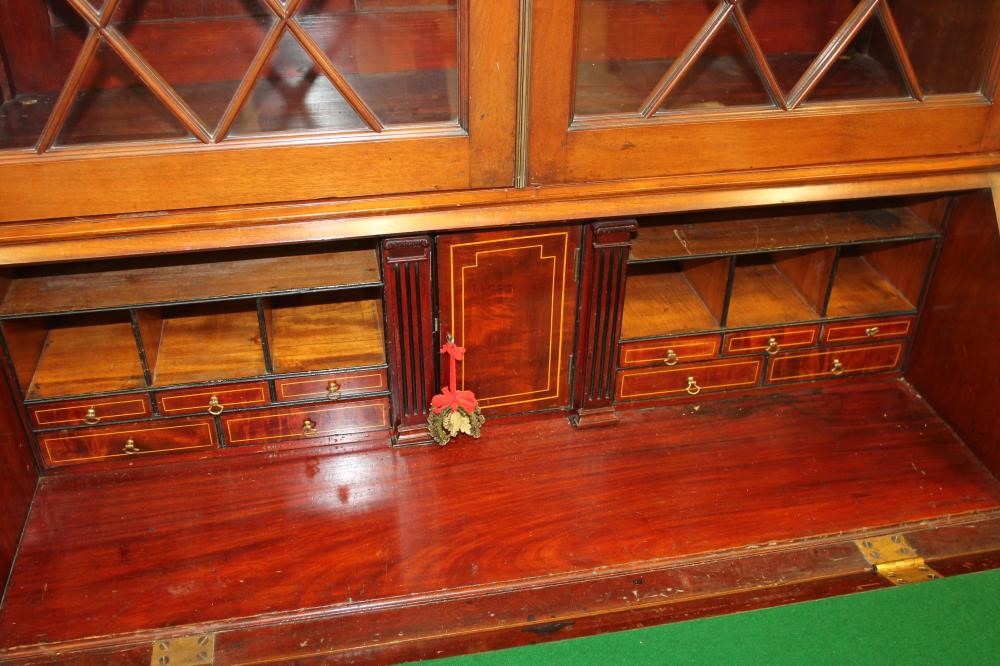 A GEORGIAN STYLE MAHOGANY AND STRING INLAID BUREAU BOOKCASE Image
