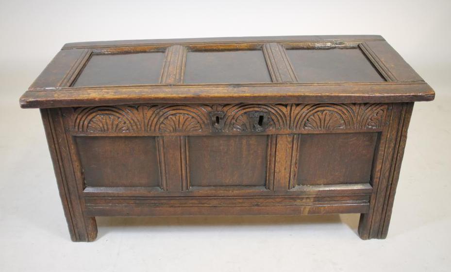AN OAK PANELLED COFFER Image