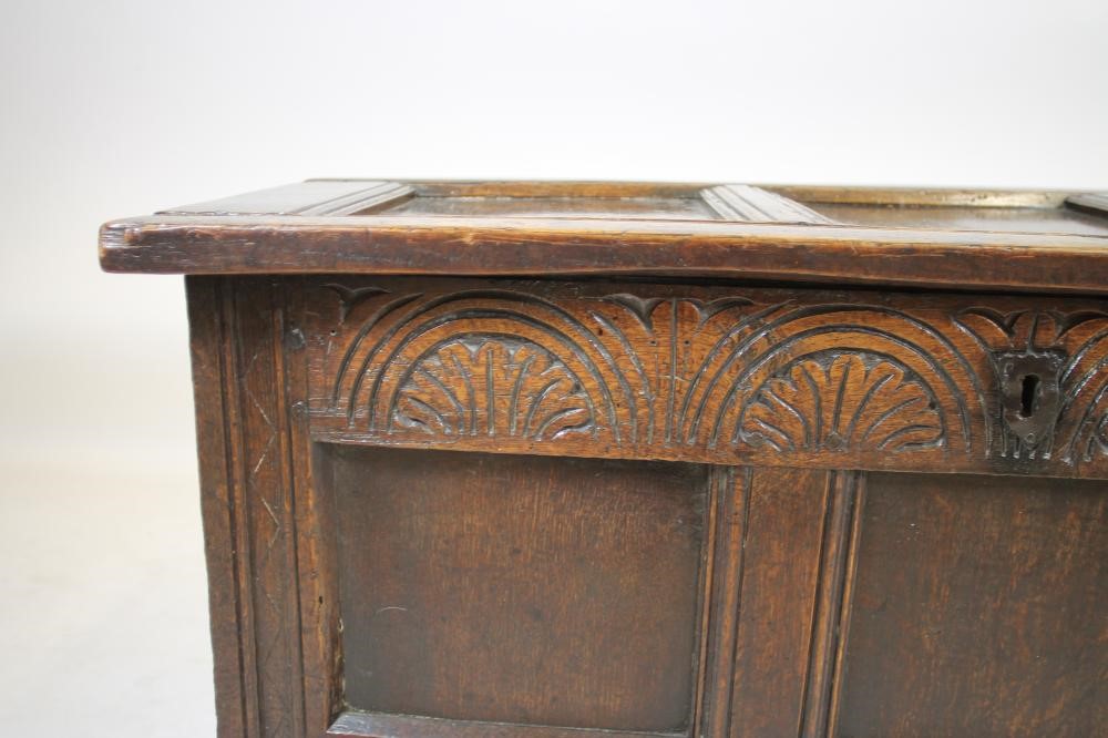 AN OAK PANELLED COFFER Image