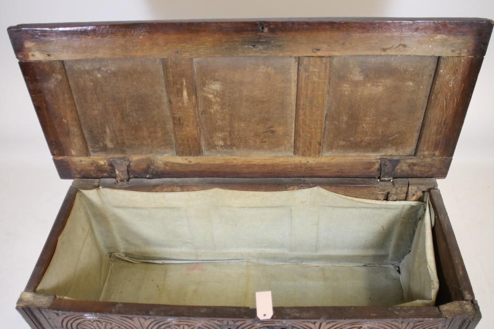 AN OAK PANELLED COFFER Image