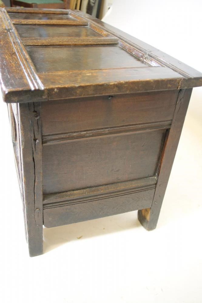 AN OAK PANELLED COFFER Image