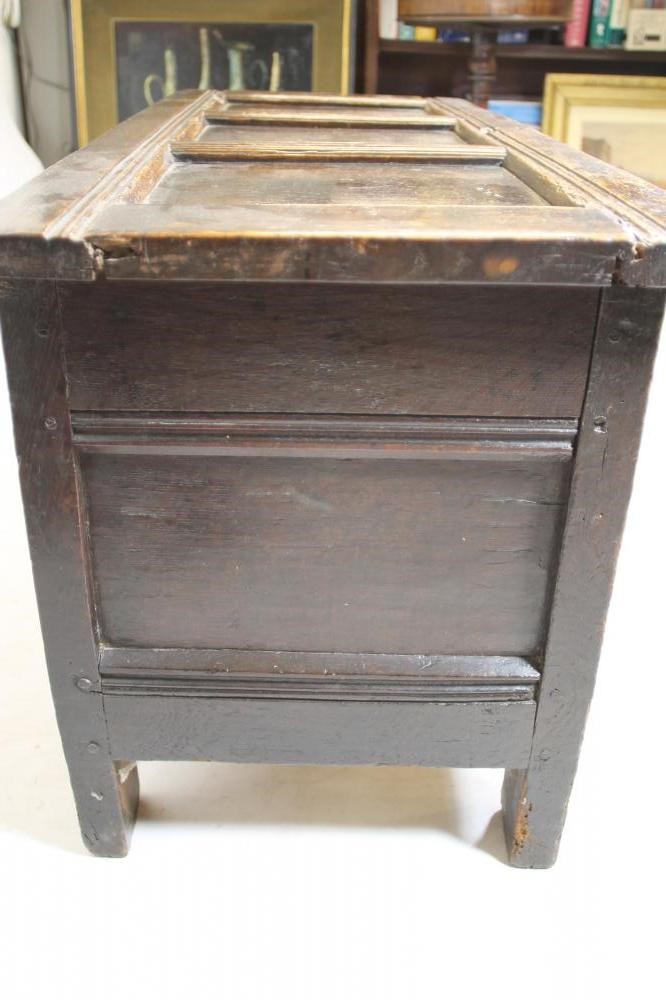 AN OAK PANELLED COFFER Image