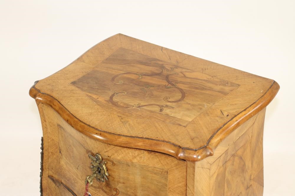 A WALNUT PETITE COMMODE Image