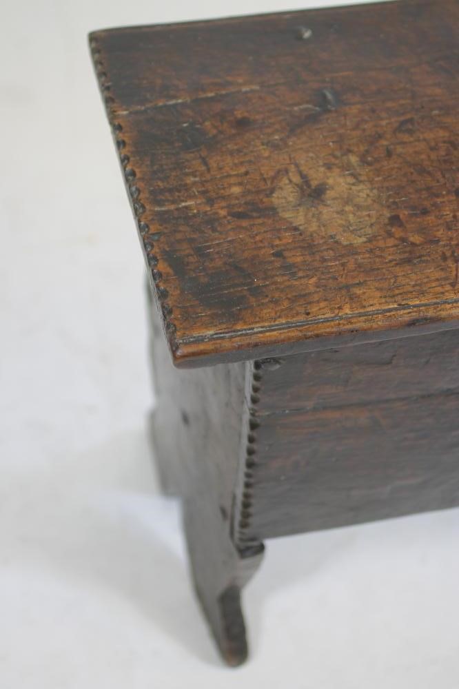 A MINIATURE OAK BOARDED CHEST Image