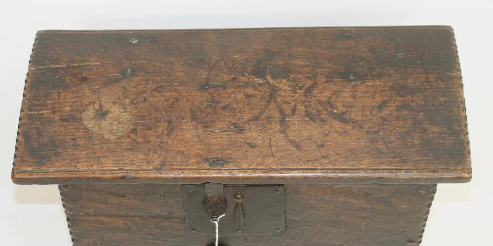 A MINIATURE OAK BOARDED CHEST Image