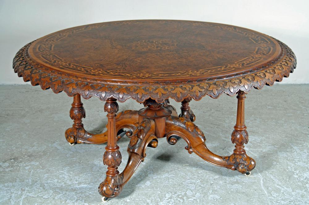 A VICTORIAN WALNUT CENTRE TABLE Image