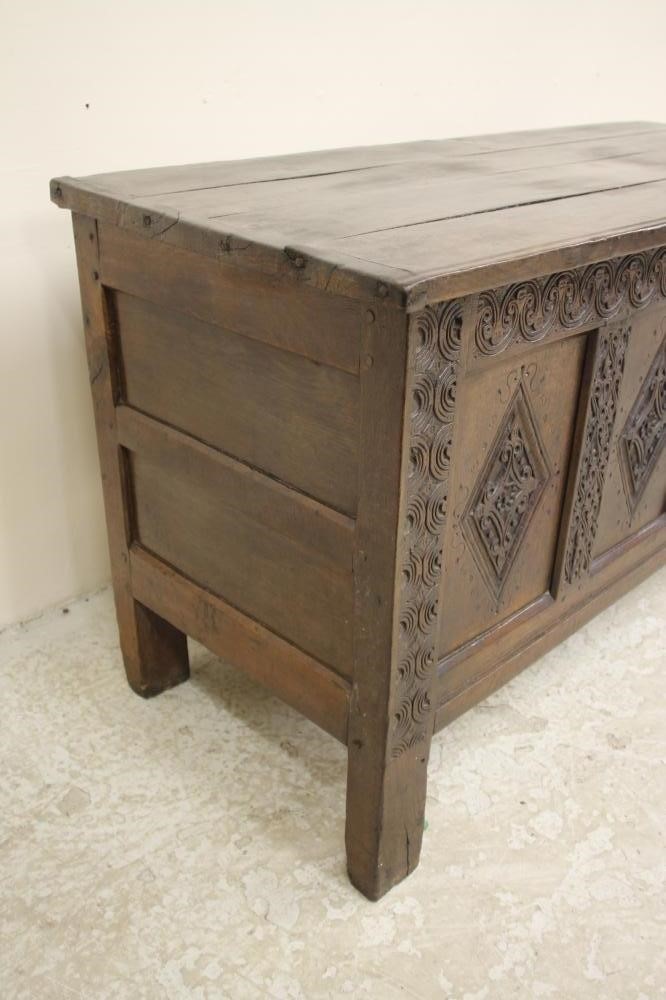 AN OAK PANELLED COFFER Image