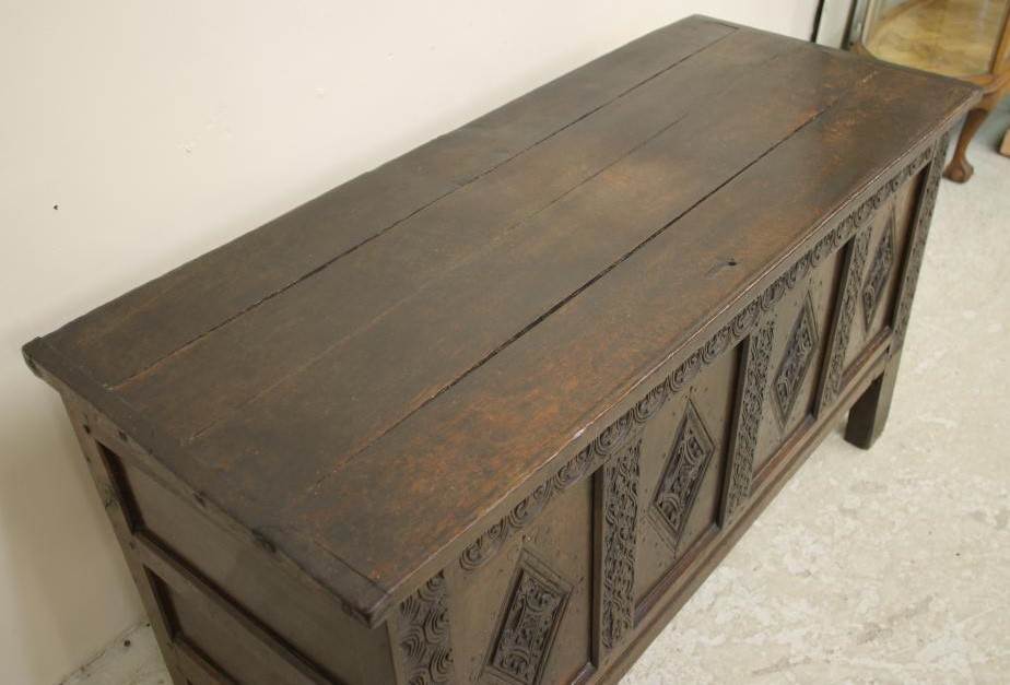 AN OAK PANELLED COFFER Image