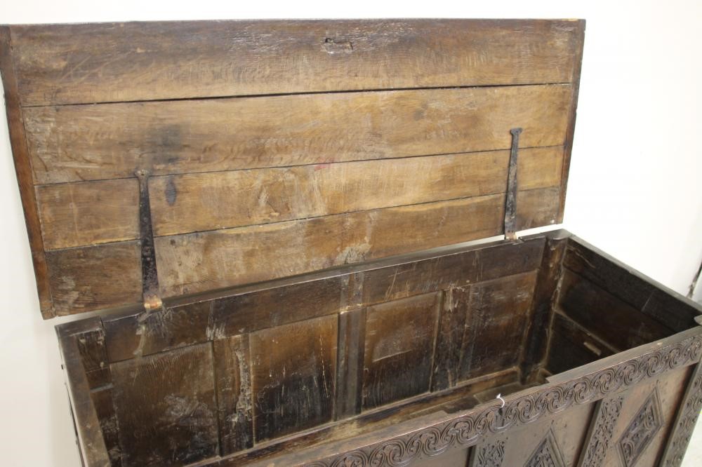 AN OAK PANELLED COFFER Image