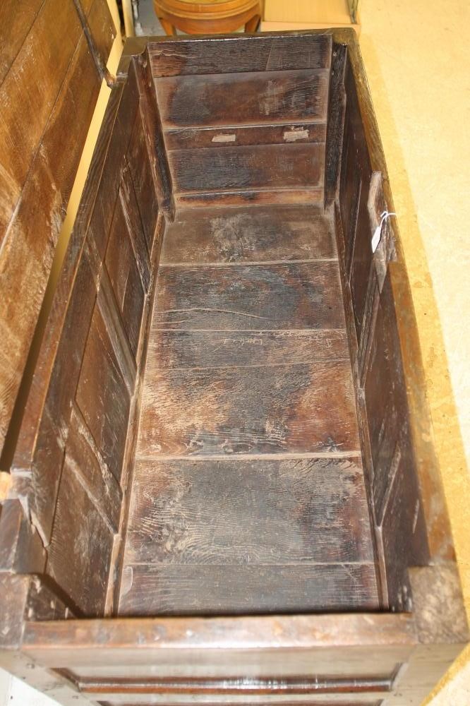 AN OAK PANELLED COFFER Image