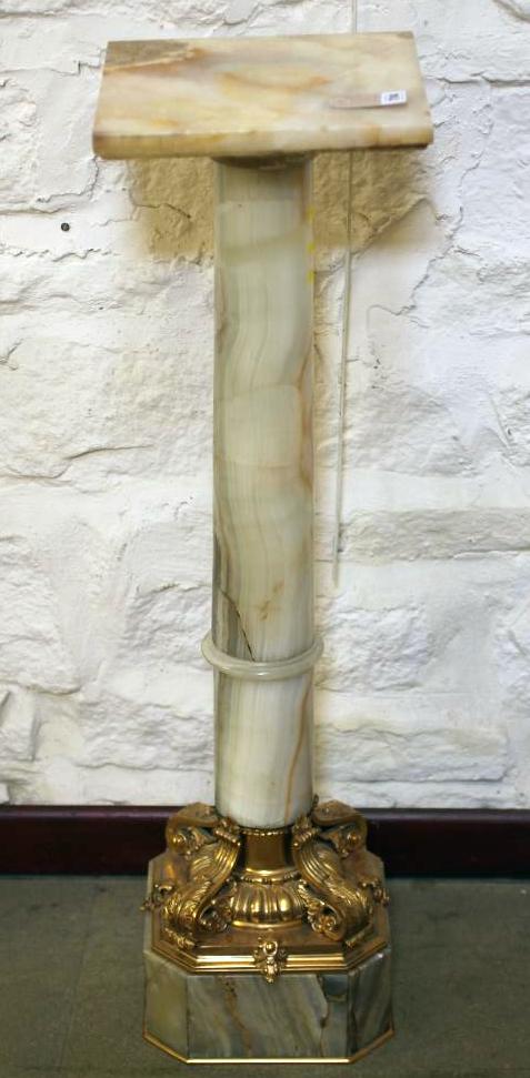 AN ONYX AND GILT METAL MOUNTED PEDESTAL Image