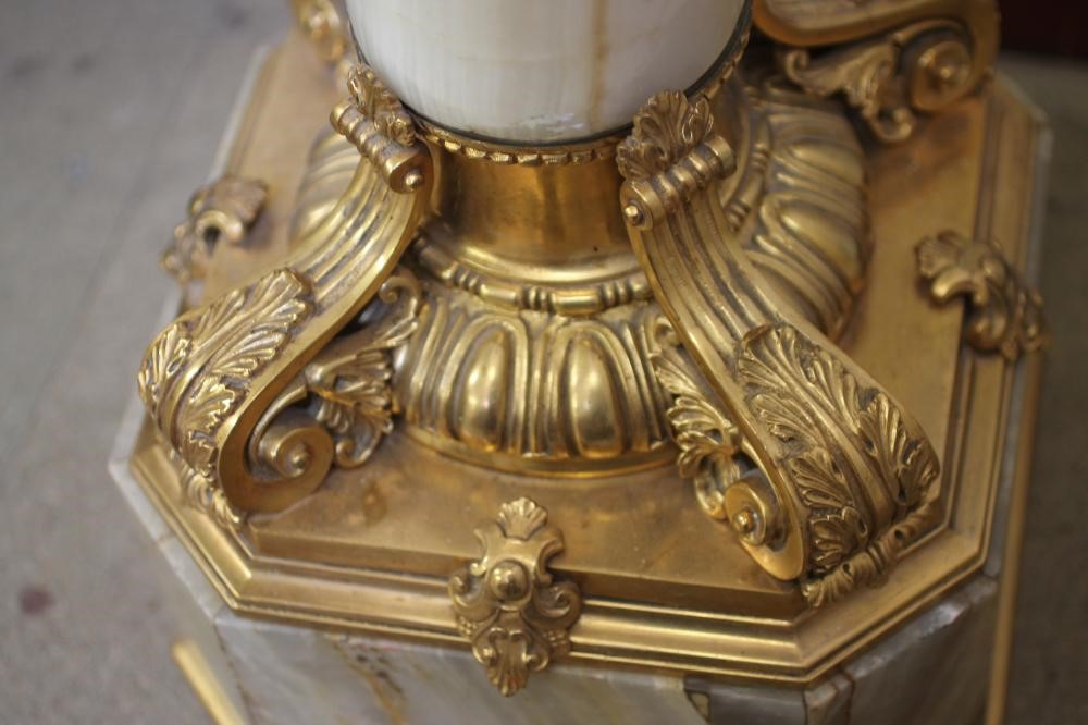 AN ONYX AND GILT METAL MOUNTED PEDESTAL Image