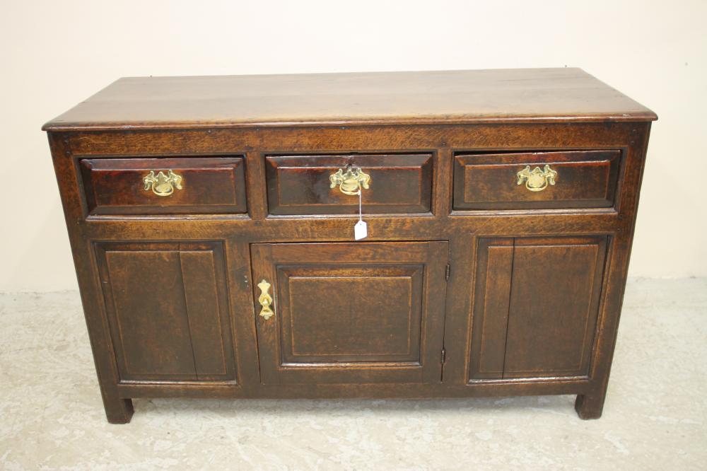 A GEORGIAN OAK ENCLOSED PANELLED DRESSER Image
