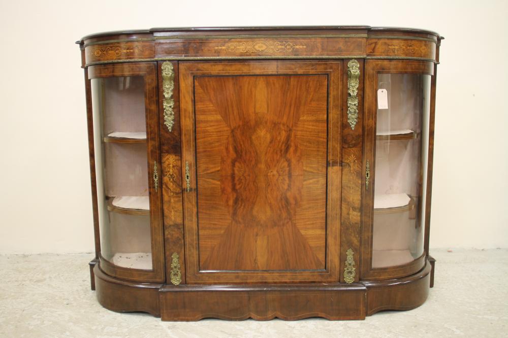 A VICTORIAN WALNUT AND EBONISED CREDENZA of breakfront D form with foliate marquetry and gilt metal Image