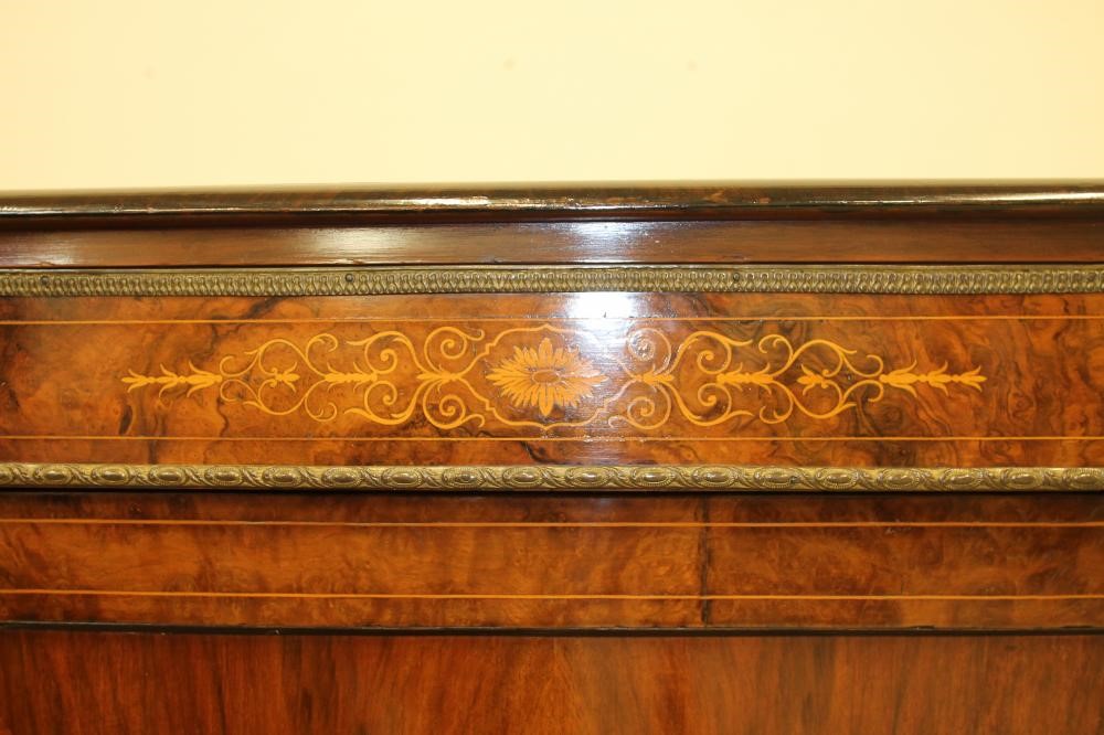 A VICTORIAN WALNUT AND EBONISED CREDENZA of breakfront D form with foliate marquetry and gilt metal Image