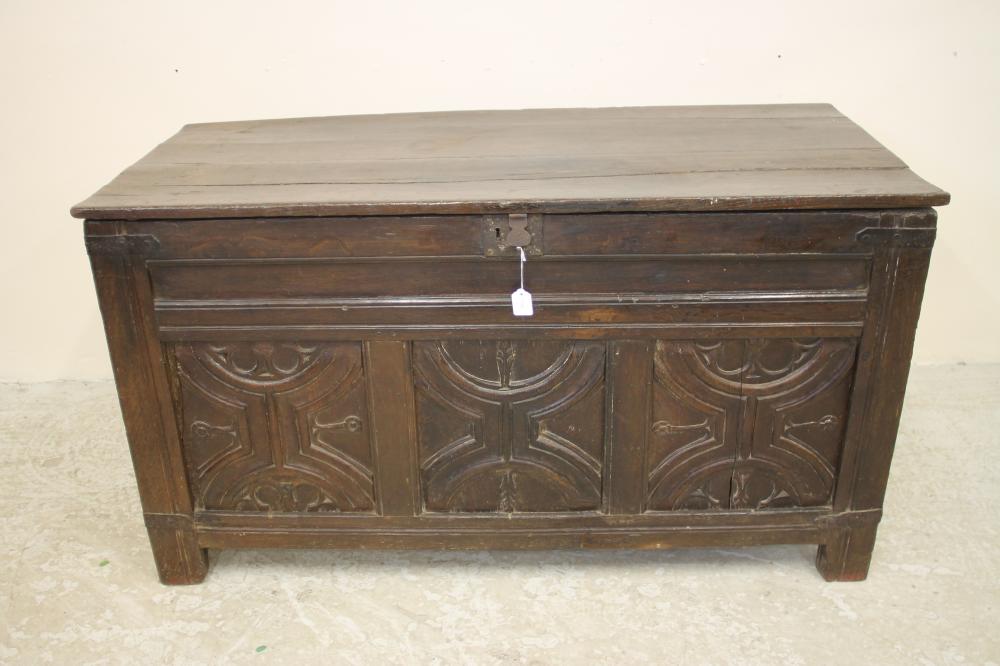 AN OAK PANELLED COFFER Image