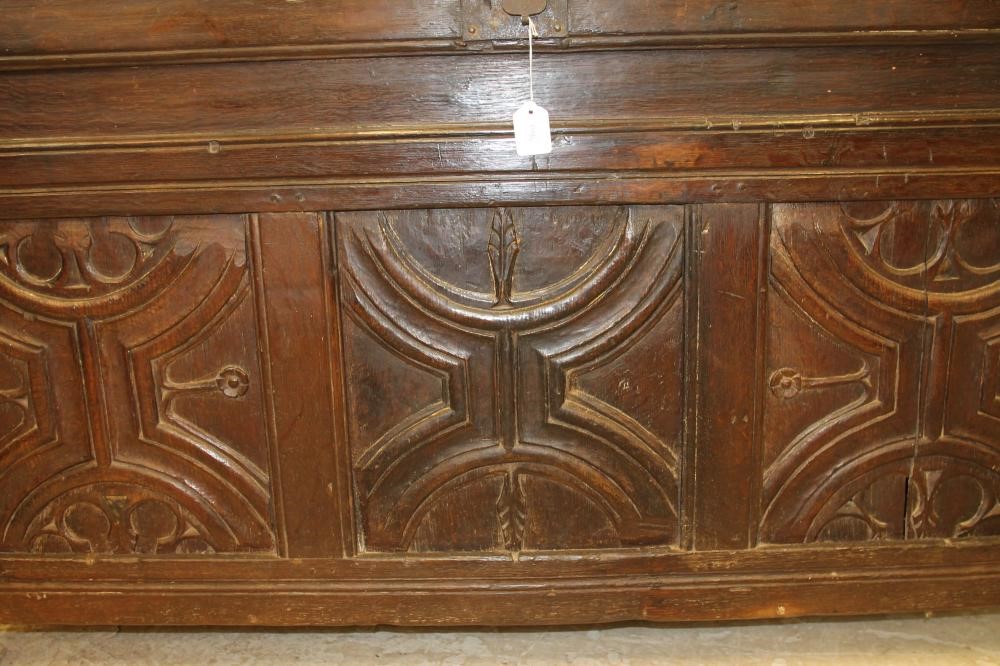 AN OAK PANELLED COFFER Image