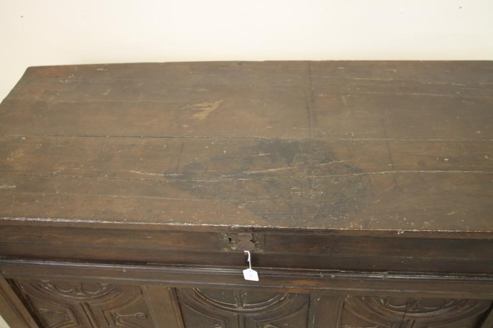 AN OAK PANELLED COFFER Image