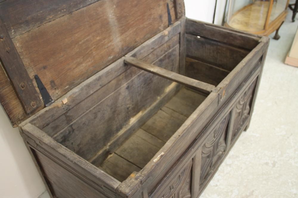 AN OAK PANELLED COFFER Image
