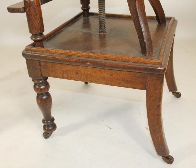 A CHILD'S EARLY VICTORIAN OAK HIGH CHAIR Image