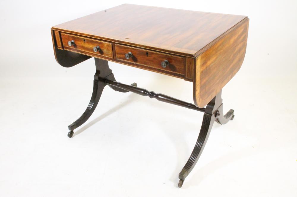 A REGENCY MAHOGANY SOFA TABLE of rounded oblong form Image