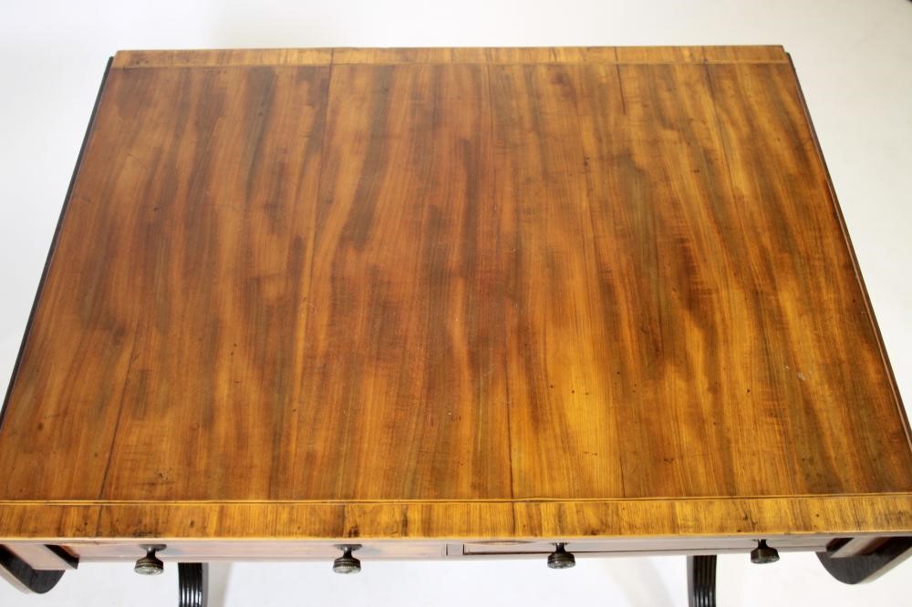 A REGENCY MAHOGANY SOFA TABLE of rounded oblong form Image