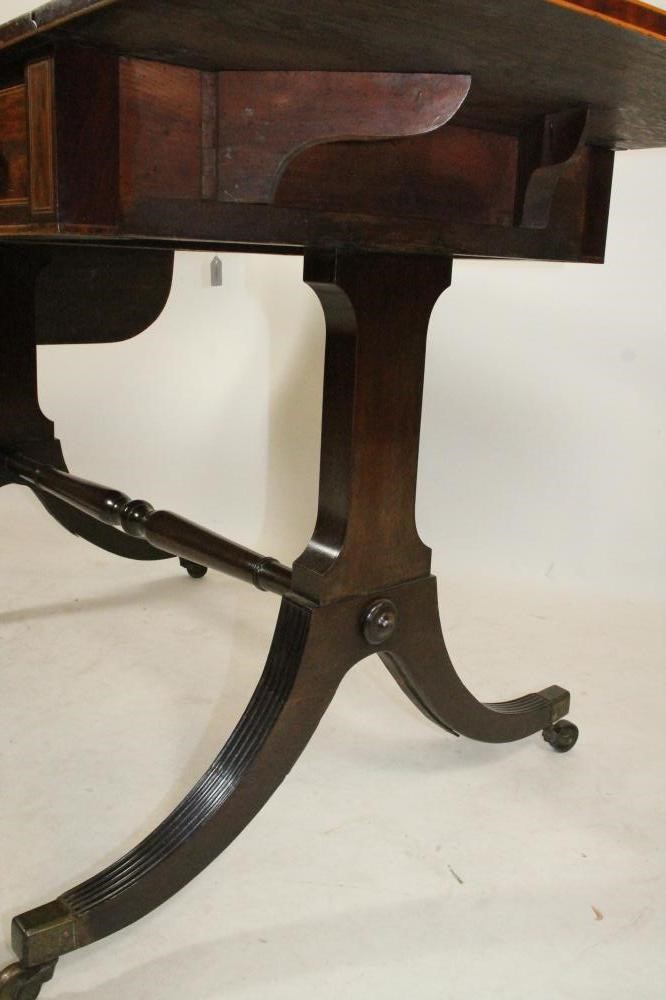 A REGENCY MAHOGANY SOFA TABLE of rounded oblong form Image
