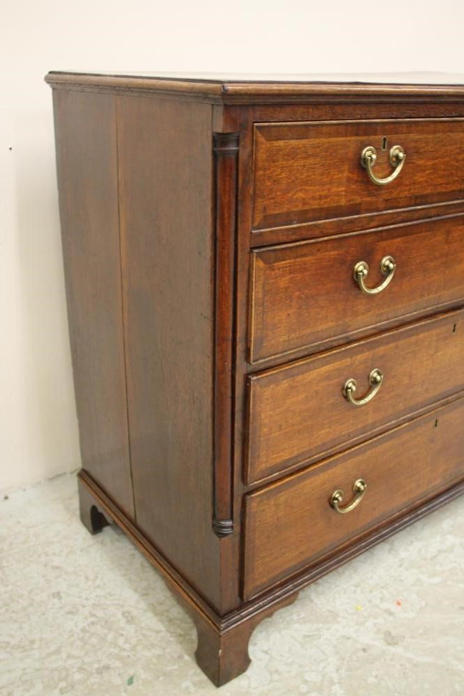 A GEORGIAN OAK AND MAHOGANY BANDED CHEST Image