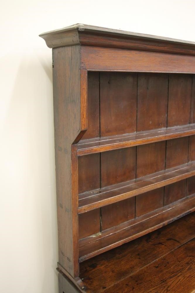 A GEORGIAN OAK ENCLOSED DRESSER Image