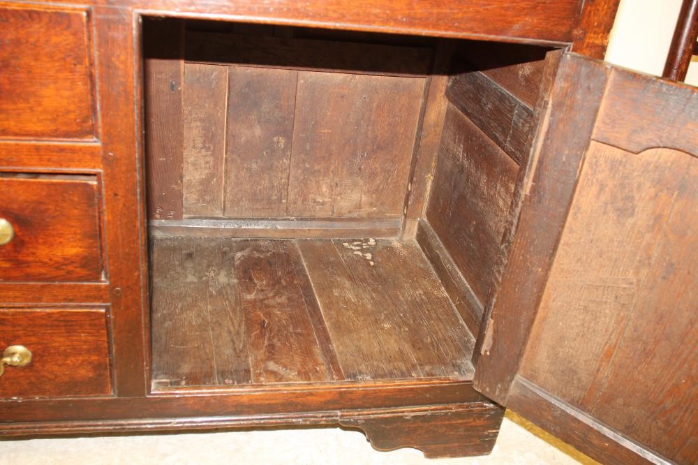 A GEORGIAN OAK ENCLOSED DRESSER Image