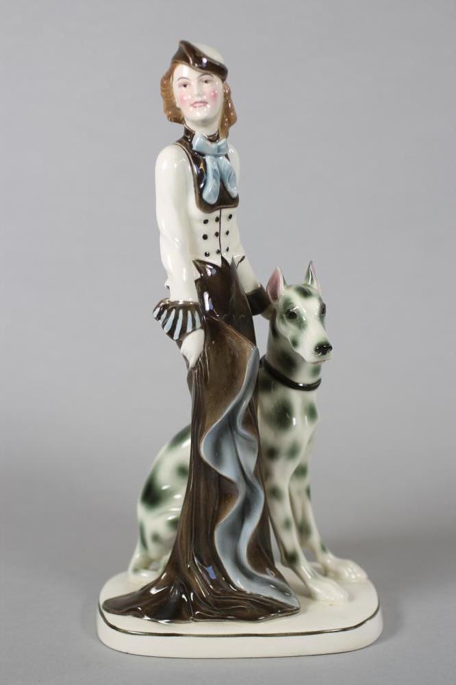 AN ART DECO KATZHUTTE EARTHENWARE FIGURE modelled as a stylish young lady wearing a hat and blue Image