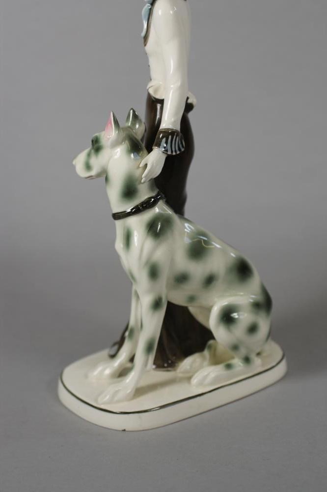 AN ART DECO KATZHUTTE EARTHENWARE FIGURE modelled as a stylish young lady wearing a hat and blue Image