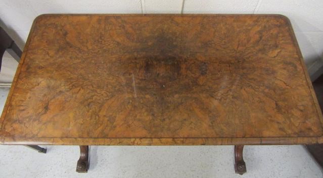 A VICTORIAN CARVED WALNUT FOLDING CARD TABLE Image