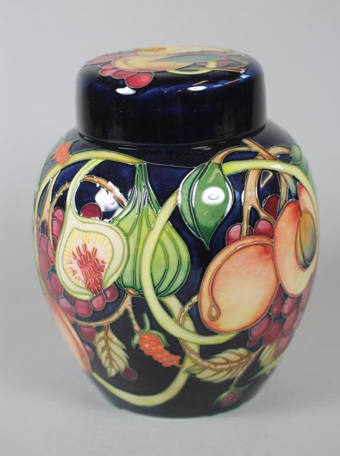 A MOORCROFT POTTERY JAR AND COVER Image